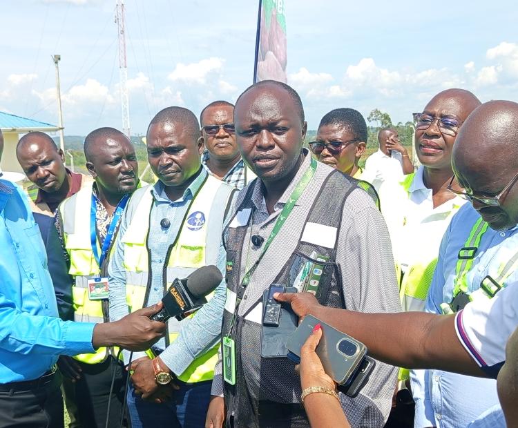 Patrick Oketch, the In-charge of Sales and Marketing at Renegade Air and other officials from both Renegade Air and Homa Bay County government speaks to the press during the official opening of the renovated Kabunde airstrip runway. PHOTO: SITNA OMAR-KNA