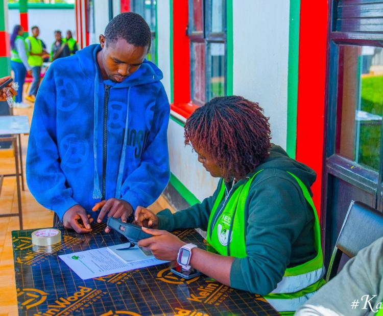 An IEBC clerk registers a new voter at Ndumberi ICT Hub in Kiambu County during the ongoing enhanced voter registration exercise.