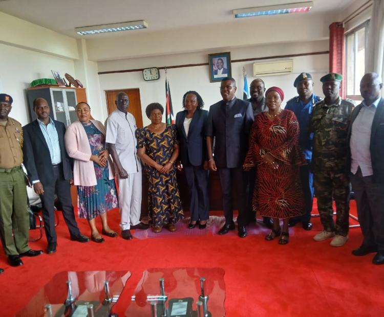NPSC chairman Amani Yuda Komora (in Kaunda suit) during a courtesy call on Nyanza Regional Commissioner Flora Mworoa. PHOTO: VALARY NYAGAKA