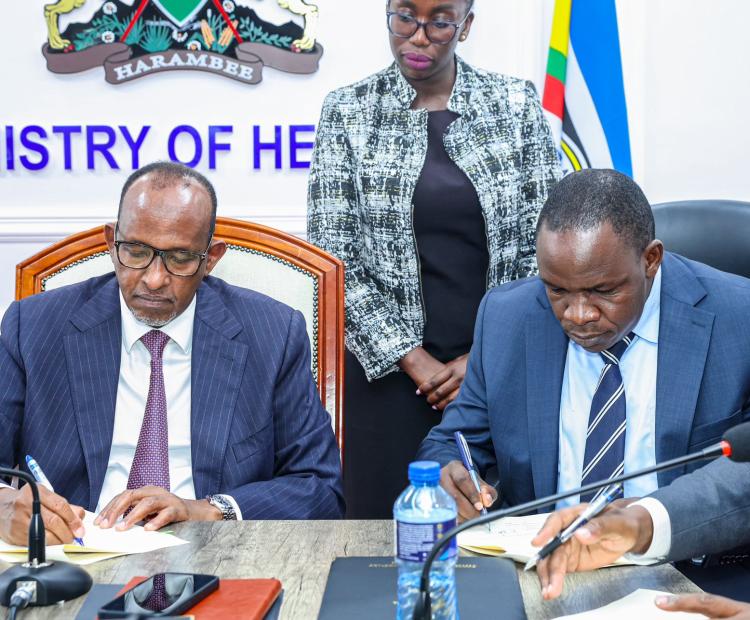 Health Cabinet Secretary Aden Duale, (left) and businessman Richard Ngatia signing a cooperation framework agreement that brings together national referral hospitals, the Social Health Authority, and the Digital Health Agency in Nairobi