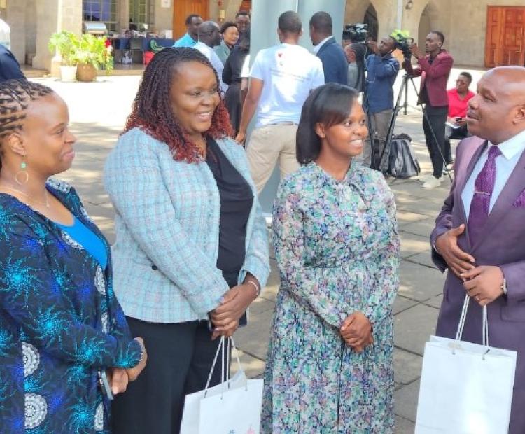 Principal Secretary for Labour and Skills Development Shadrack Mwadime (right) speaking to stakeholders during the consultation on ILO Conventions 189 and 190 at All Saints Cathedral Hall, Nairobi.