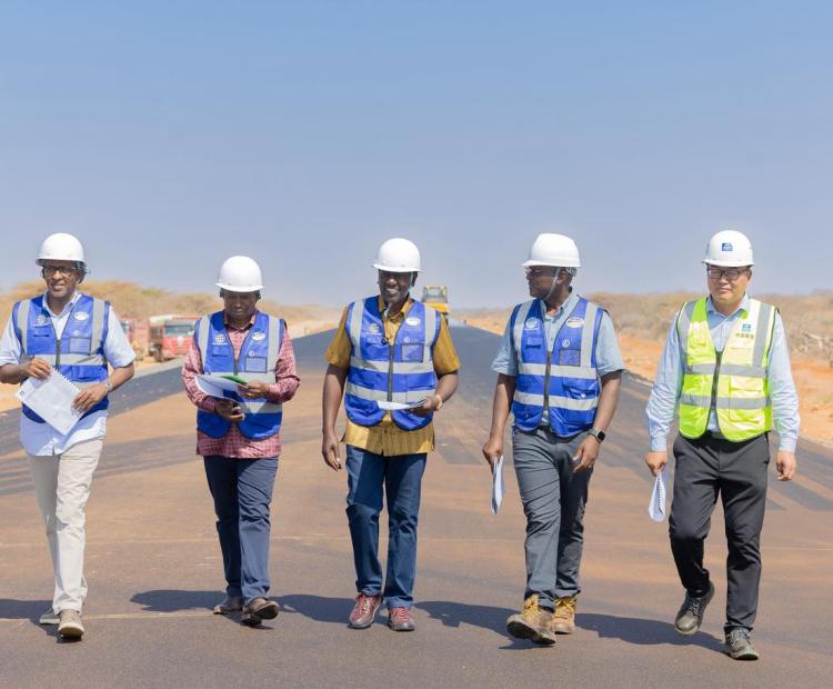 President William Ruto(middle) flanked by Deputy President Kithure Kindiki Health CS Aden Duale and contractor along the Isiolo–Mandera road