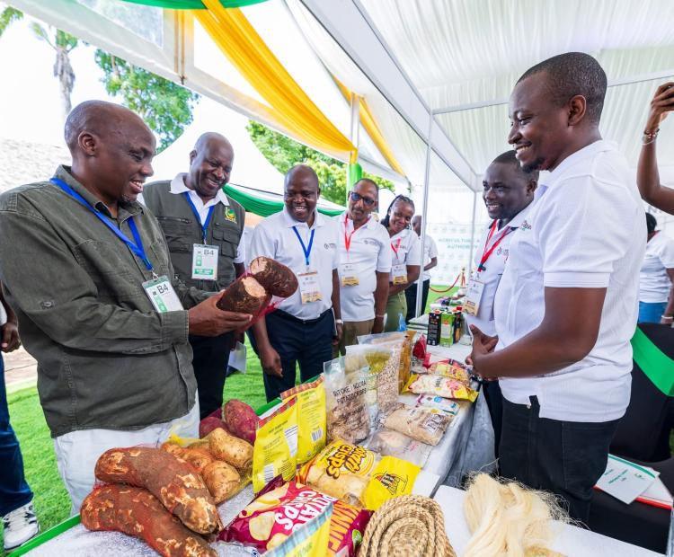 Agriculture PS Dr. Paul Ronoh (left) tours an exhibition stand showcasing various farm produce during a national agricultural forum in Kwale County, PHOTO: CHARI SUCHE