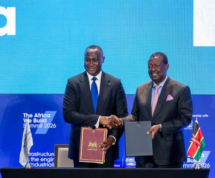 Prime Cabinet Secretary and Cabinet Secretary for Foreign and Diaspora Affairs, Musalia Mudavadi (right), and AFC President and Chief Executive Officer, Samaila Zubairu, during the signing of an agreement at the Africa We Build Summit in Nairobi.