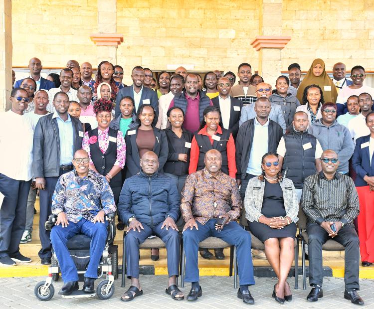 Public Service Commission Chairman Francis Meja (centre, front row) joined by fellow Commissioners during the training programme held in Naivasha for mentors in Ministries, Departments and Agencies who will be tasked to oversee successful induction and guide interns posted by the Commission. PHOTO: ERASTUS GICHOHI
