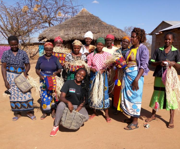 Sheila Atieno Onyango (squatting in black t-shirt) poses for a photograph with some of the women she works with. PHOTO: PAMELLA DOROTHY