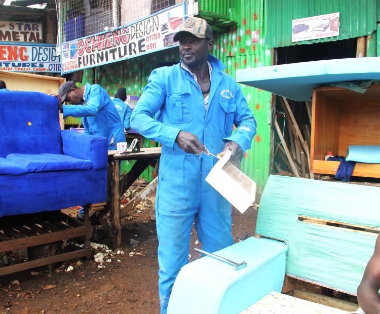 William Ochieng works on a furniture project at his workshop in Kericho town. After acquiring vocational skills while serving a prison sentence, Ochieng rebuilt his life through entrepreneurship and now mentors young artisans and supports his family through furniture-making. PHOTOS: GILBERT MUTAI