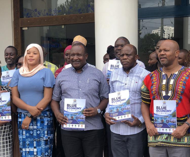 Officials display copies of the newly launched Jumuiya ya Kaunti za Pwani (JKP) Blue Economy Multi-Agency Action Plan (JKP-BEMAP) 2026- 2030, a Sh156 billion ($1.2 billion) roadmap for jobs, climate resilience and shared prosperity across Kenya’s six coastal counties, during the launch ceremony in Mombasa. PHOTO: RAMADHAN NASSIB