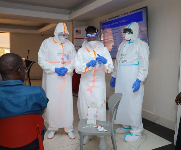 Kenya National Public Health Institute (KNPHI) staff demonstrating PPE donning and doffing practical training session ahead of potential Ebola outbreak in the country.