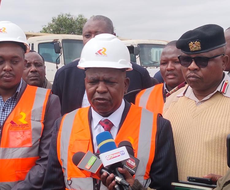 Kenya Railways Managing Director Philip Mainga (centre) addresses the media during the official launch of the Naivasha–Kisumu–Malaba Standard Gauge Railway (SGR) extension in Narok. The project is expected to enhance transport links between the Port of Mombasa and the Uganda border. PHOTO: HILLARY SHIMNAGHA/KNA.