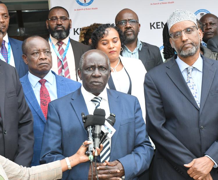 The National Assembly Departmental Committee on Health Chairperson, Dr. James Nyikal, addresses the media in Nairobi after undertaking a fact-finding visit to the Kenya Medical Research Institute (KEMRI) Multi-Phase Laboratories, Training and office facility, currently under construction at the Kenyatta National Hospital Complex. He is flanked by other members of the Committee (Back), KEMRI Director General and Ag. Vice Chancellor Prof. Elijah Songok (Left), and KEMRI’s Board of Directors, Dr Abdullahi Ali 