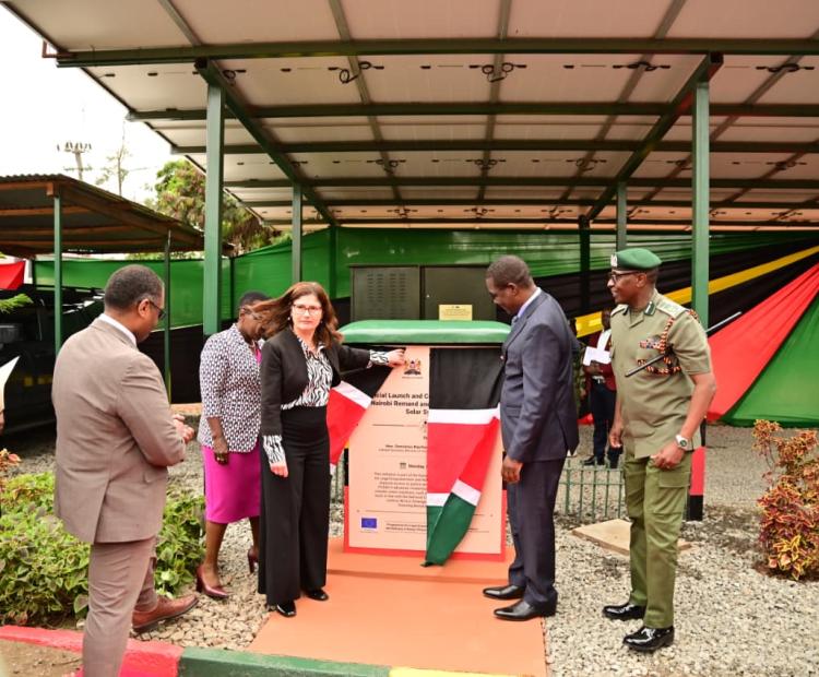 Energy and Petroleum Cabinet Secretary Opiyo Wandayi (Right) and European Union Ambassador Henriette Geiger (Centre) commission solar-powered at the Nairobi Remand and Allocation Maximum Security Prison.