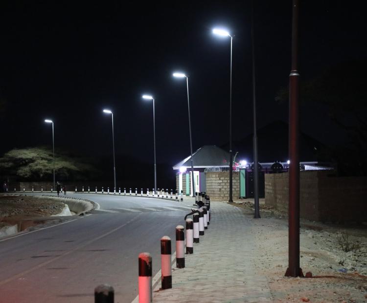 Solar-powered streetlights illuminate a road upgraded under KISIP II (50), improving security and extending business hours in Wajir Municipality. (51)
