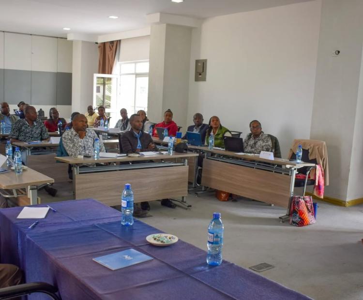 Agritech/County agricultural extension officers, researchers, and stakeholders follow a presentation during the VarScout platform review meeting in Nakuru. 