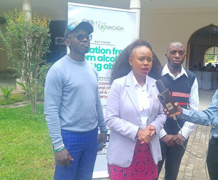 Youth representative Ruth Machocho briefs the press during the opening of the youth summit on drug and crime prevention in Mombasa, flanked by other participants at the venue.