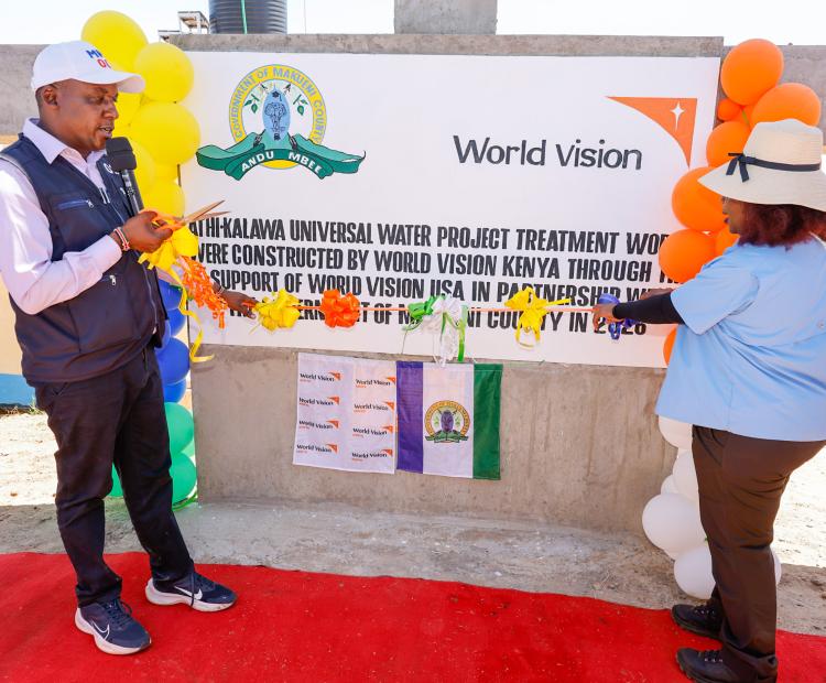 Makueni Governor Mutula Kilonzo Jr. (left) and World Vision East Africa Regional Director Lilian Dodzo commissioning the Sh450 million Athi-Kalawa Water Supply (AKWASH) Project in Kwakiliu in Kalawa Ward, Mbooni East Sub County.