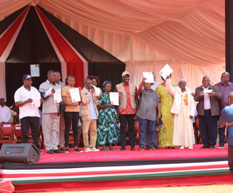 President William Roto (sixth left) with a section of beneficiaries during the issuance of more than 31,000 title deeds to residents of Taita Taveta County.
